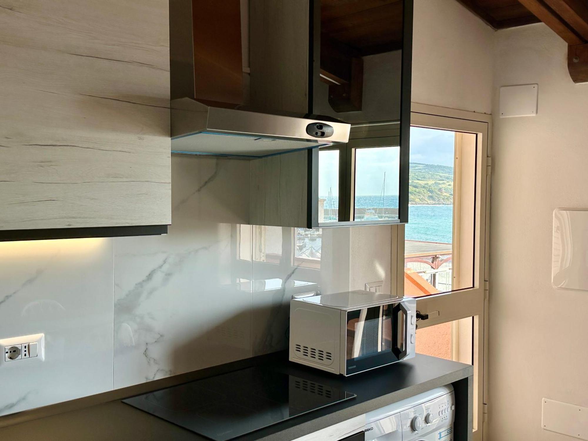 Approdo Apartments Isola Rossa Exterior photo