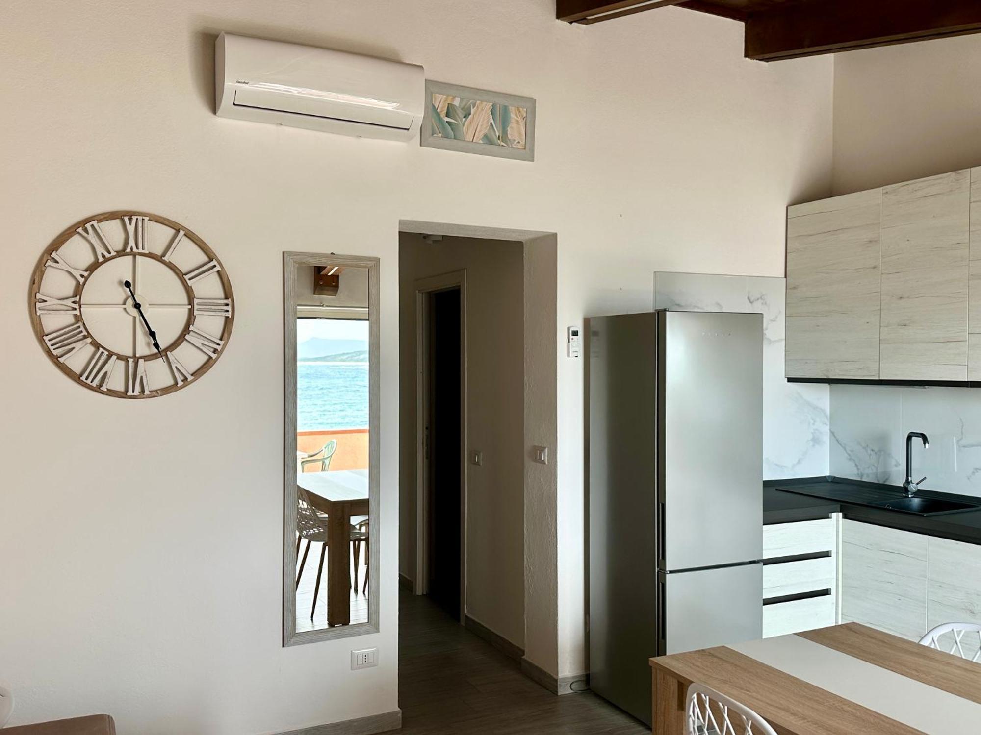 Approdo Apartments Isola Rossa Exterior photo