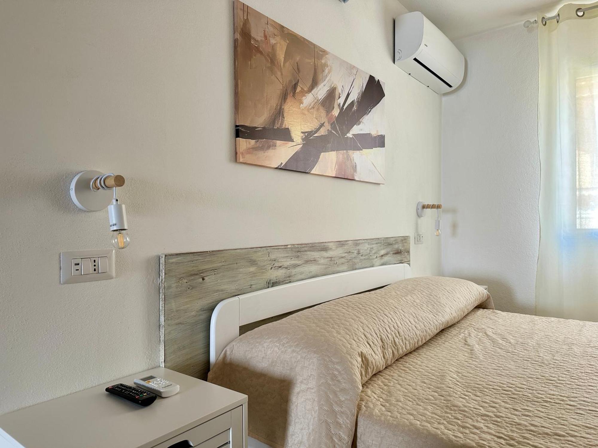 Approdo Apartments Isola Rossa Exterior photo